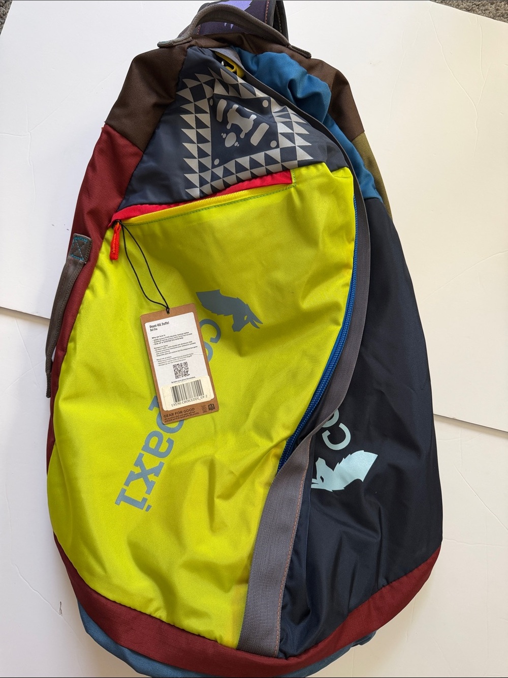 the Cotopaxi Uyuni 46L Duffel Bag (Del Día Edition).
